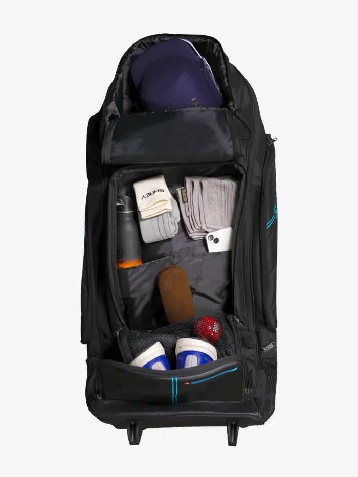 Black Cric Studio Canada Shrey Kitbag Meta Duffle Wheelie 120 with wheels and handles for easy travel storage.