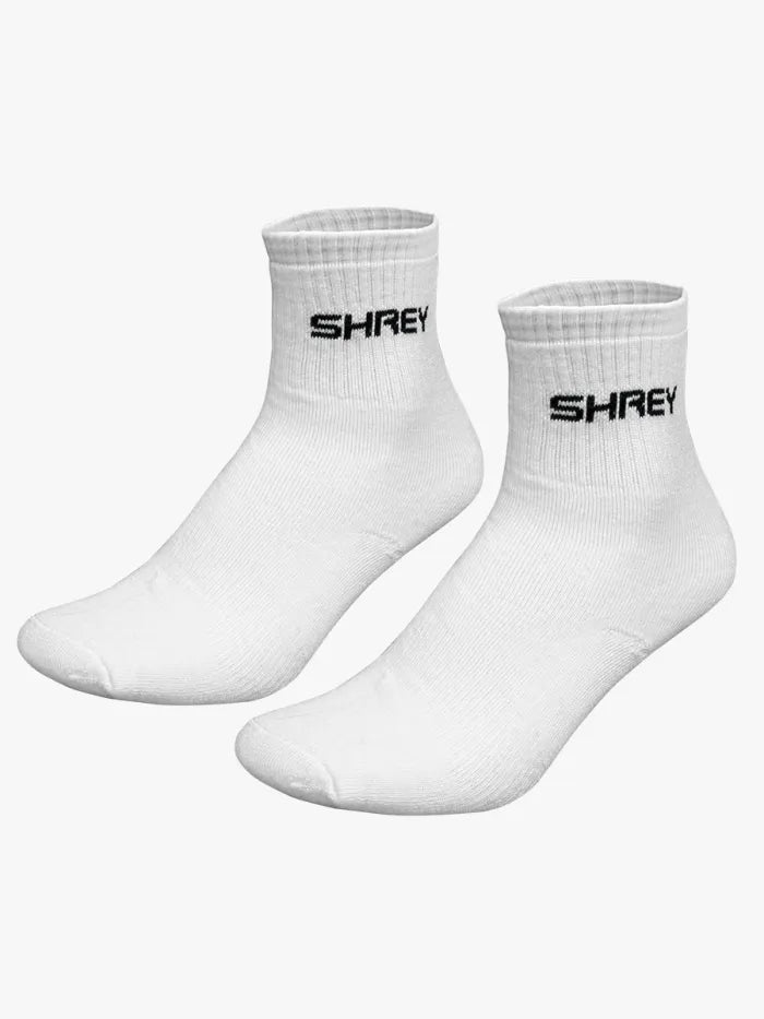 White cricket socks from the Shrey Star Cricket Kit by Cric Studio Canada, displayed in a kitbag.