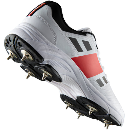 Gray Nicolls Velocity Spike cricket shoes with gray and black design, featuring spike soles for enhanced grip and performance.