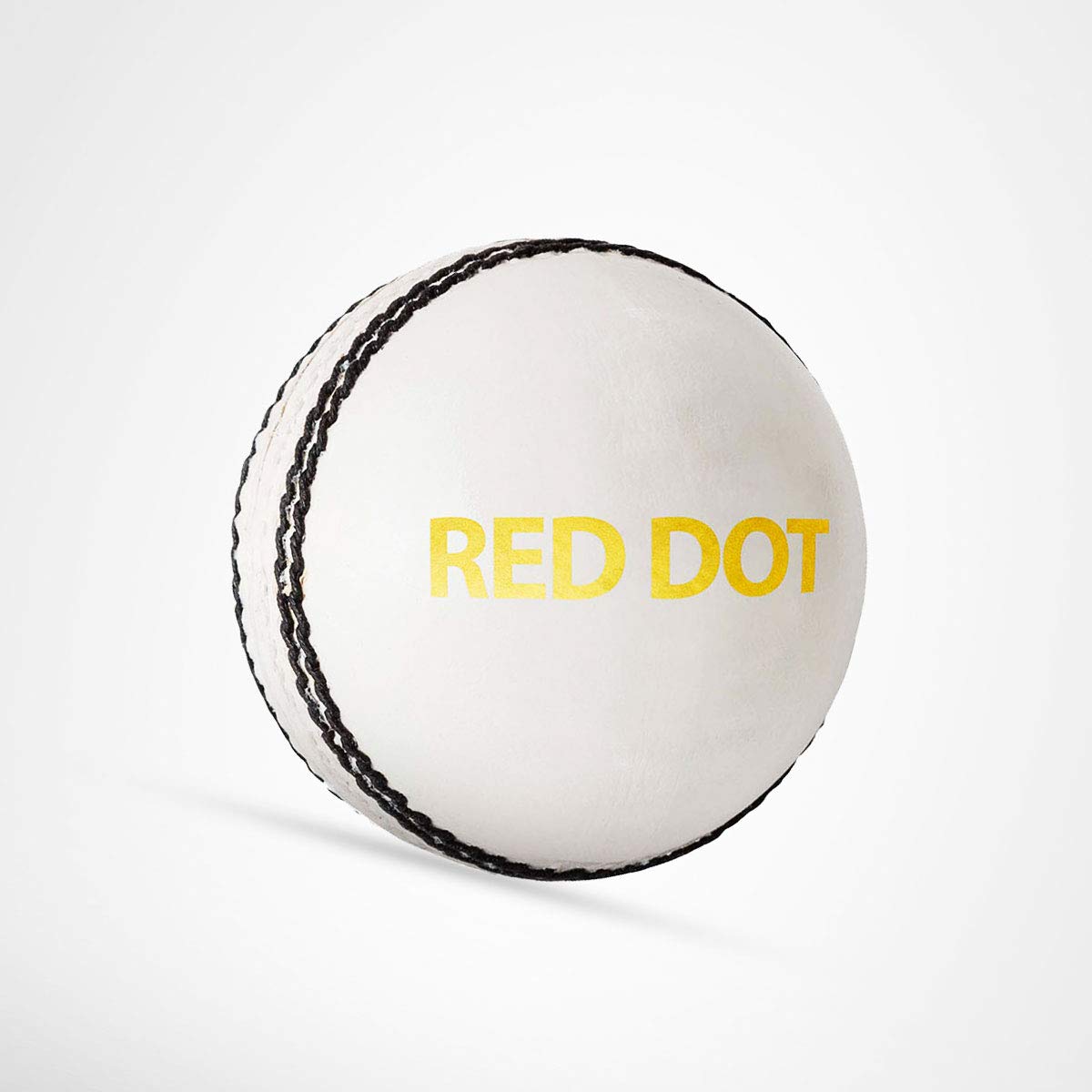 Cric Studio Canada red dot leather ball with white surface, crafted for sports and outdoor play