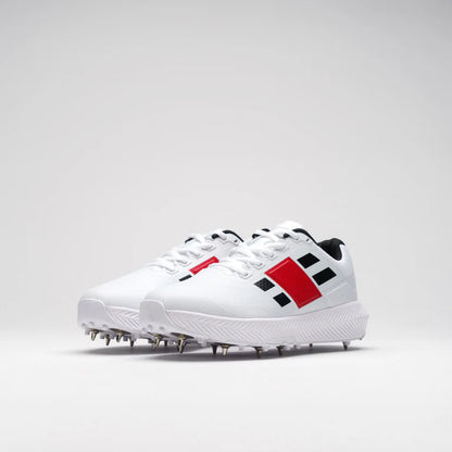 Pair of GN Evo Pro 1.0 Spike shoes by Cric Studio Canada, showing the lightweight athletic shoes with spike soles.