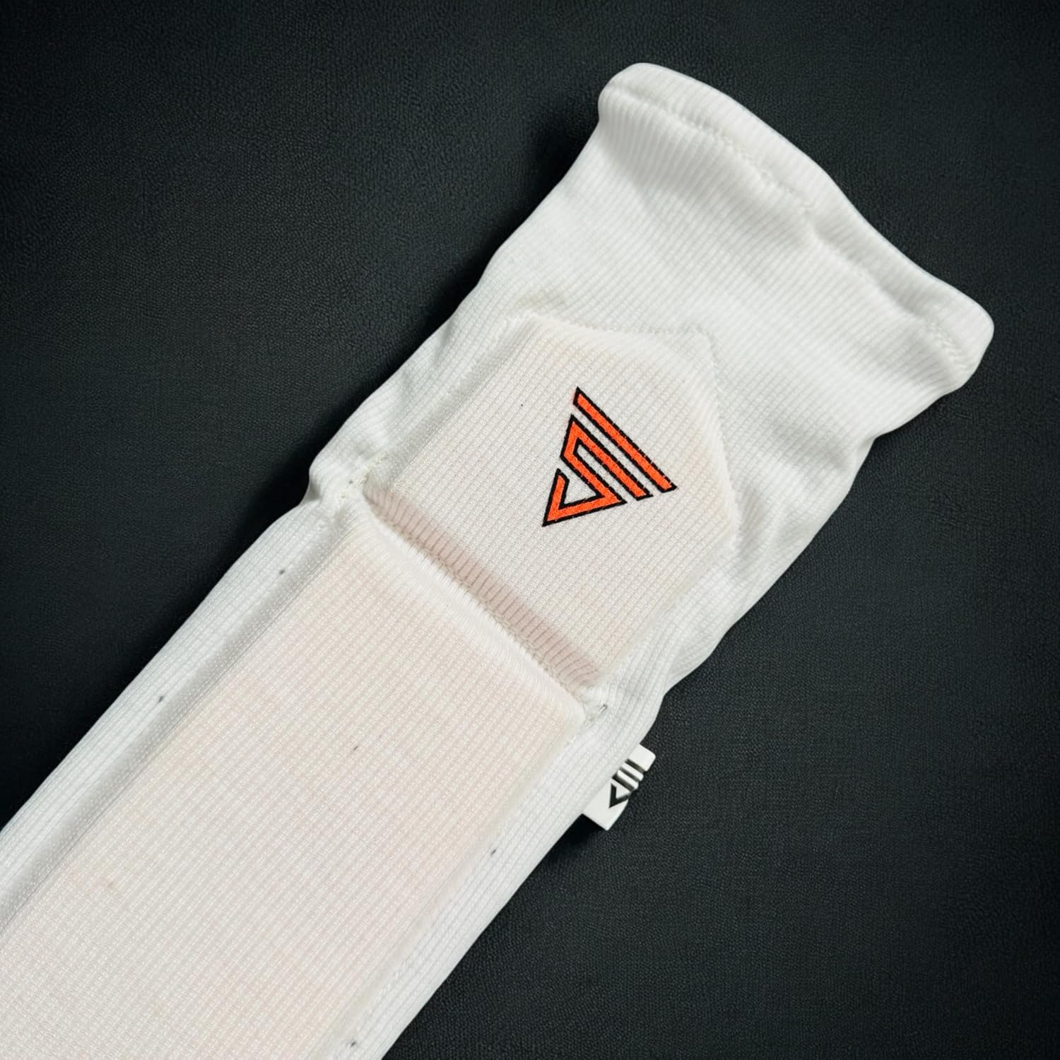 Cric Studio Canada Versant GC Arm Guard for cricket players, black protective arm shield with padding, on a white background.