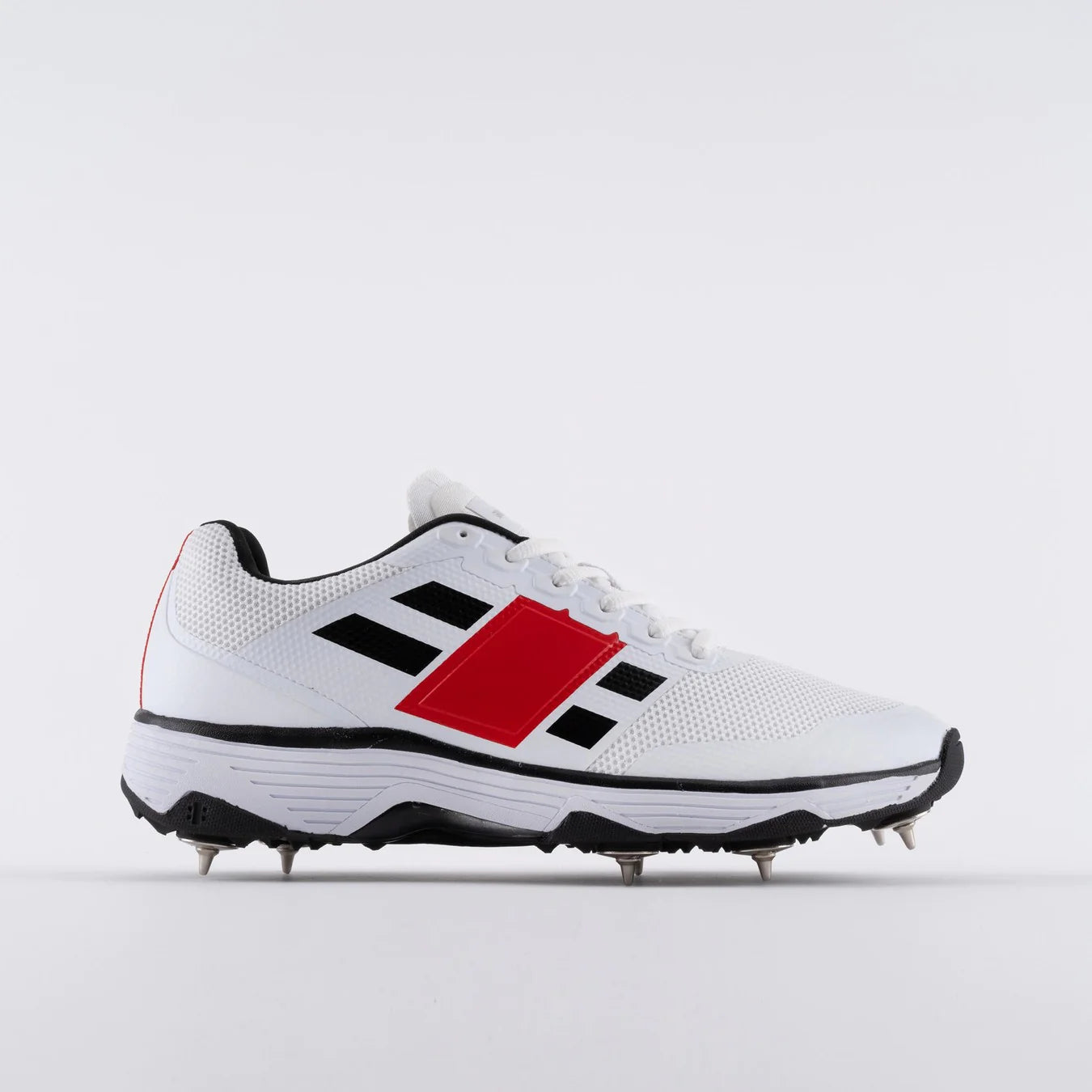 Crick Studio Canada GN8 Players Spike Cricket Shoes showing black and white athletic shoes with spikes for cricket players