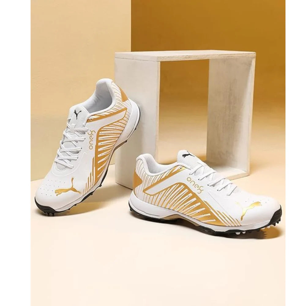 Puma Cricket Shoes 22 FH Rubber VK, black and white athletic cricket shoes with rubber soles, designed for sport performance.