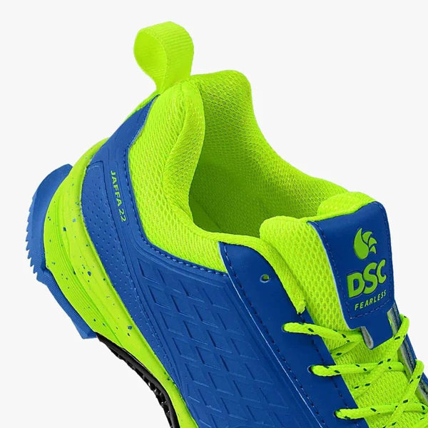 DSC Jaffa 22 cricket shoes in red and black, lightweight sports footwear with grip soles, designed for cricket players.