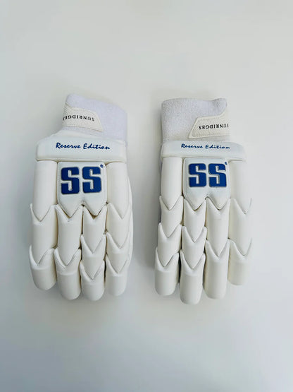 Cricket batting gloves from Cric Studio Canada's SS Reserve Edition, white and black with padded finger and palm protection.