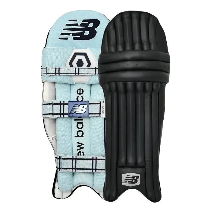 Navy blue New Balance TC 8i cricket batting pads with black accents, designed for leg protection during cricket matches.
