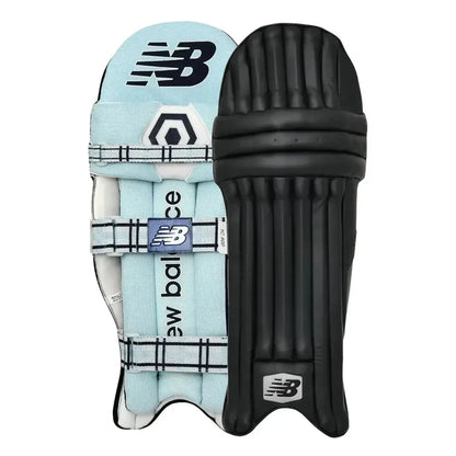 Navy blue New Balance TC 8i cricket batting pads with black accents, designed for leg protection during cricket matches.