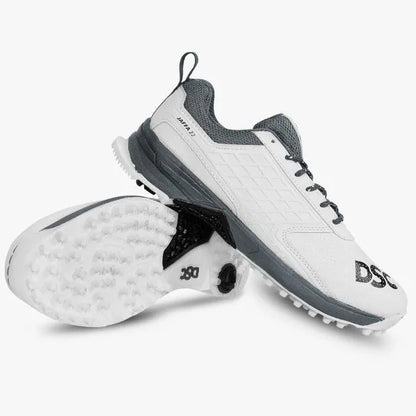 DSC Jaffa 22 cricket shoes in white and dark grey, lightweight athletic shoes designed for cricket players.