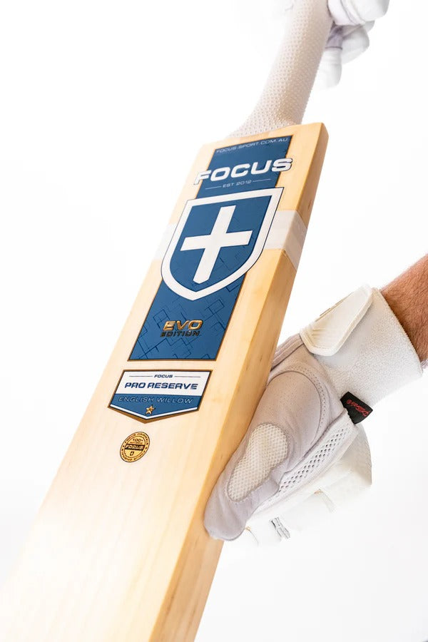 Cricket bat by Cric Studio Canada, Focus Evo Performance EW model, showing the wooden blade and grip details.