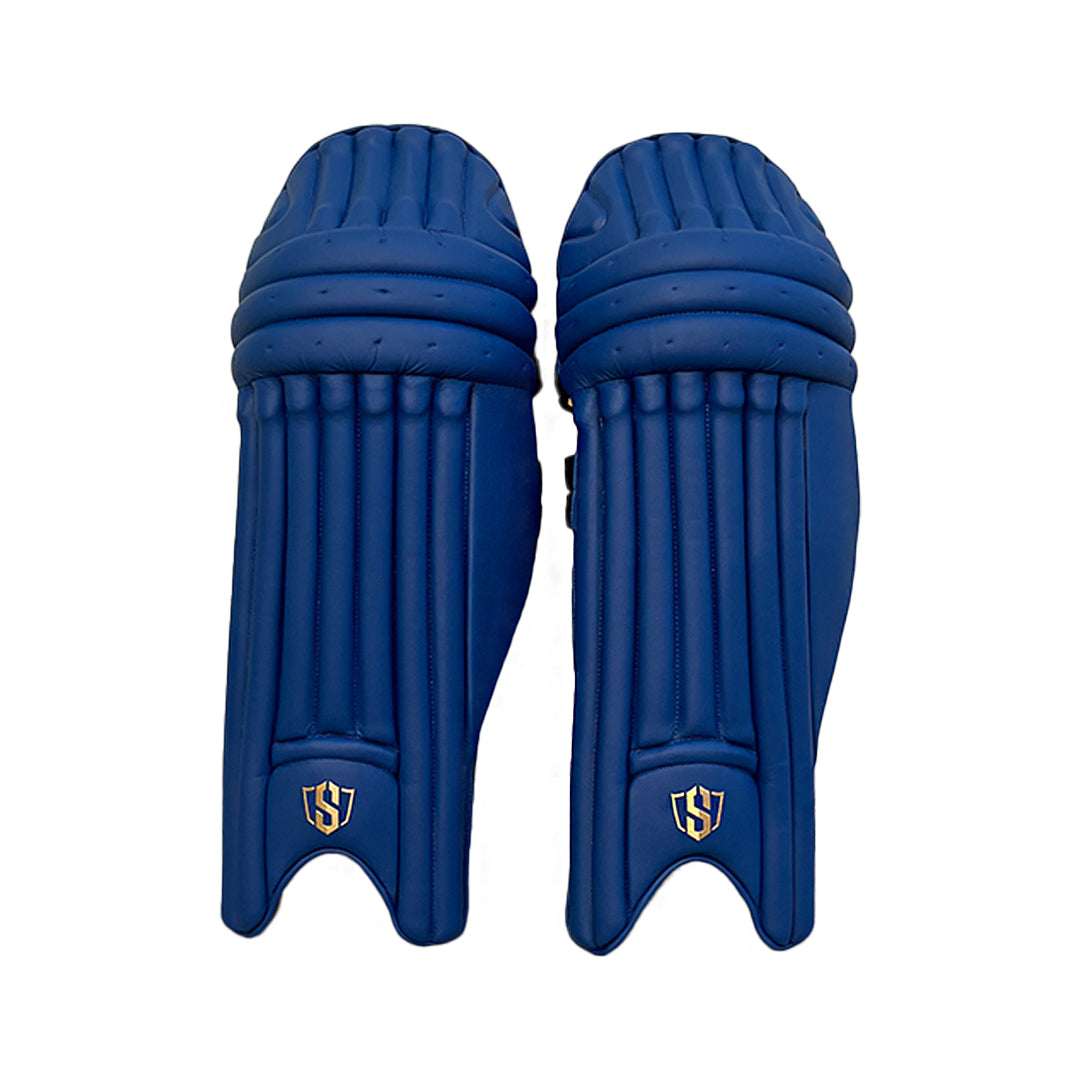 Royal blue Swar Apothesis premium cricket batting leg guards by Cric Studio Canada, showing padded protective leg guards for cricket.